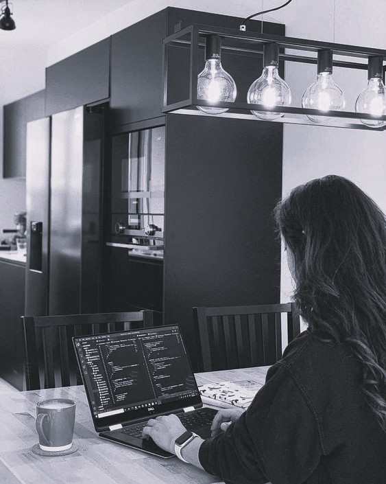 girl working on laptop in a cafe